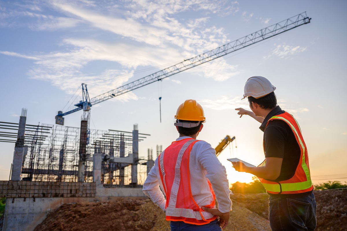 Construction workers in red hard hats